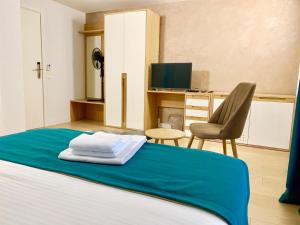 Postel nebo postele na pokoji v ubytování Hotel Adore