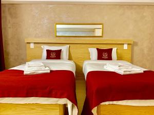 Postel nebo postele na pokoji v ubytování Hotel Adore