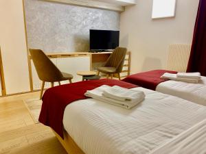 Postel nebo postele na pokoji v ubytování Hotel Adore