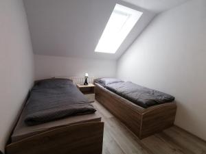 A bed or beds in a room at Private house in Liptovsky Hradok