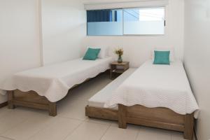 Ένα ή περισσότερα κρεβάτια σε δωμάτιο στο Magico Apartamento Frente al Mar 2 Habitaciones PAZ124