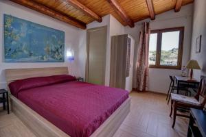 Posteľ alebo postele v izbe v ubytovaní Casa Vacanza Villa Anna