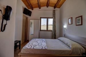 Posteľ alebo postele v izbe v ubytovaní Casa Vacanza Villa Anna