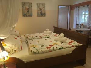 a bedroom with two beds with towels on them at Alte Schule Niederdünzebach in Eschwege