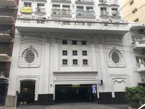 a large white building with a lot of windows at Corazón de Recoleta in Buenos Aires