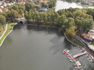 an aerial view of a river with boats in a marina at Villa Severin apartments in Kaliningrad
