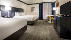 Ένα ή περισσότερα κρεβάτια σε δωμάτιο στο OYO Hotel and Casino Las Vegas