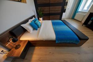 A bed or beds in a room at Le Monde Apartment Bratislava - amazing 5BDR in downtown