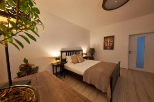 A bed or beds in a room at Le Monde Apartment Bratislava - amazing 5BDR in downtown