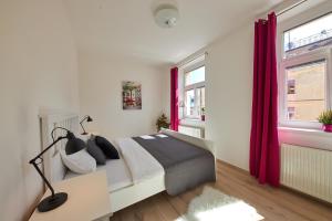 A bed or beds in a room at Le Monde Apartment Bratislava - amazing 5BDR in downtown