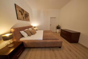 A bed or beds in a room at Le Monde Apartment Bratislava - amazing 5BDR in downtown
