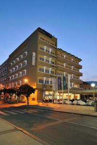 a hotel building on a city street at night at Hotel Bristol in Mostar