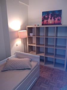 a living room with a couch and a tv at Rozy House Nei Epivates Thessaloniki ( Near the sea) in Neoi Epivates