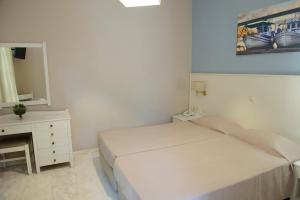 Postel nebo postele na pokoji v ubytování Kalydna Island Hotel