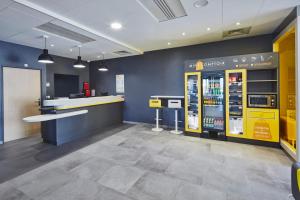 a room that has a lot of different types of vending machines in it at Premiere Classe Clermont Ferrand Centre in Clermont-Ferrand