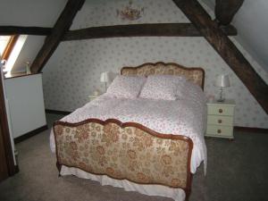a bedroom with a large bed with a canopy at Lark Cottage in Pickering