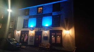 a building with blue lights on the side of it at The Dunning Hotel in Perth