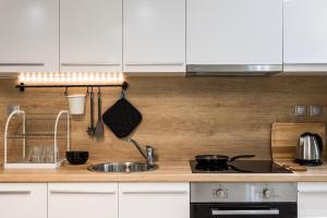 A kitchen or kitchenette at modern city center maisonette