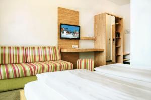 En eller flere senge i et værelse på Der Seebacherhof