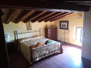 a bedroom with a bed and a dresser at Centro Storico in Anagni