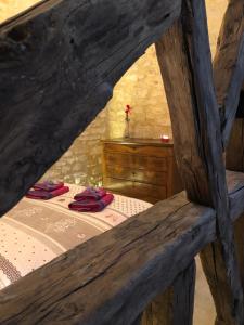 a bedroom with a bed in a wooden building at Les Arcades in Sarlat-la-Canéda