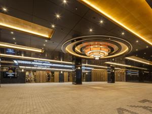 a large building with a large ceiling with a large room at APA Hotel & Resort Yokohama Bay Tower in Yokohama