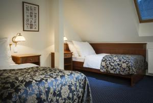 Postel nebo postele na pokoji v ubytování OREA Spa Hotel Bohemia Mariánské Lázně