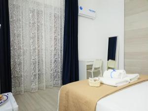 Postel nebo postele na pokoji v ubytování AlbaChiara B&B