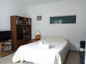 Postel nebo postele na pokoji v ubytování Milenio III B&B