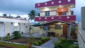 a large house with a purple roof at Freshup & Stay in Chikmagalūr