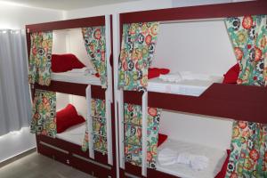 a group of bunk beds in a room at Bonabrigo Hostel & Suítes in Balneário Camboriú