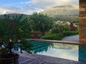 a swimming pool with a view of a mountain at Casa Lia da Pôrta in Caminha