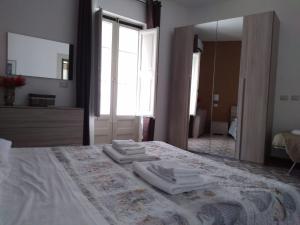 Postelja oz. postelje v sobi nastanitve Una Scala Dal Centro
