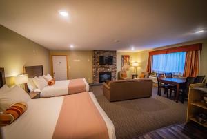 Voodi või voodid majutusasutuse Alpine Inn & Suites toas