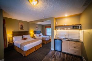 Voodi või voodid majutusasutuse Alpine Inn & Suites toas