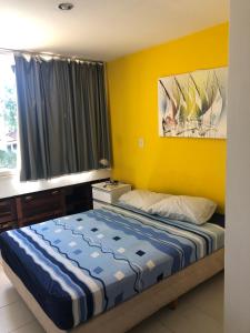 Tempat tidur dalam kamar di Casa na Rua Principal - Pipa Atlântico
