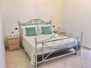 Postel nebo postele na pokoji v ubytování B&B LA PIETRA