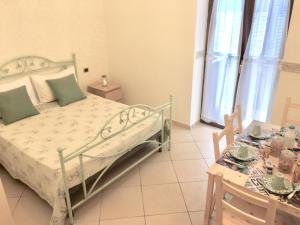 Postel nebo postele na pokoji v ubytování B&B LA PIETRA