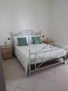 Postel nebo postele na pokoji v ubytování B&B LA PIETRA