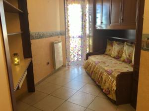 Postel nebo postele na pokoji v ubytování B&B LA PIETRA