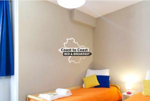 Postel nebo postele na pokoji v ubytování B&B Coast to Coast