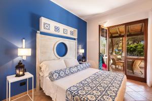 Postel nebo postele na pokoji v ubytování Hotel Orsa Maggiore + 37 fotografií