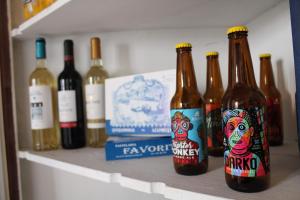 a row of bottles of wine on a shelf at Casa da Rainha in Azambuja +42 photos