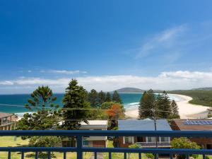 a view of a beach from a balcony at Blue Waters at Gerroa in Gerroa