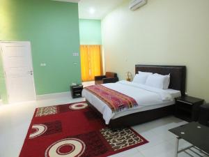 מיטה או מיטות בחדר ב-GLOBAL VIEW HOTEL