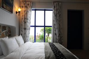 Postel nebo postele na pokoji v ubytování Chateau Villa