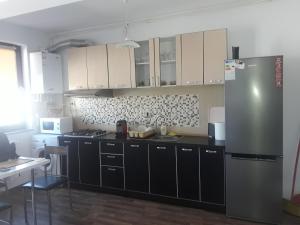 Kuchyň nebo kuchyňský kout v ubytování Aquazure Residence