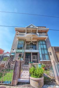 a house with a gate in front of it at Anping Pet Island in Tainan
