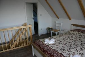 
Ein Bett oder Betten in einem Zimmer der Unterkunft Apartment Jakobsweg GbR

