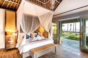 Voodi või voodid majutusasutuse Nirwana Beach & Resort toas